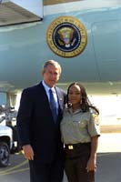 President George W. Bush met Malikah Rashied upon arrival in Stockton, California on Friday, August 23, 2002. Rashied works with the California Conservation Corps assisting with fire prevention and community clean-up projects. 