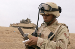 An Air Force staff sergeant operates a GPS navigation device.