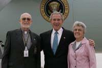 President George W. Bush presented the President’s Volunteer Service Award to Chaplain Bob Floyd upon arrival at the airport in Richmond, Virginia, on Thursday, October 19, 2006.  Floyd is a volunteer with the Vietnam Veterans of America and the Chesterfield County Police Department.  To thank them for making a difference in the lives of others, President Bush honors a local volunteer, called a USA Freedom Corps Greeter, when he travels throughout the United States.  President Bush has met with more than 500 individuals around the country, like Floyd, since March 2002.