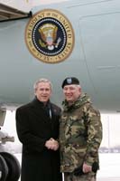 President George W. Bush presented the President’s Volunteer Service Award to Don Kotchman upon arrival at Selfridge Air National Guard Base, Michigan, on Friday, January 7, 2005.  Kotchman, an Army colonel, is an active volunteer with Boy Scouts of America and as a coach for youth sports programs. 