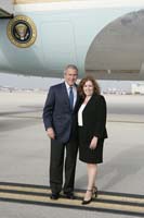 President George W. Bush presented the President’s Volunteer Service Award to Dorcas Piegari upon arrival at the airport in Miami, Florida, on Sunday, July 30, 2006.  Piegari is a volunteer with Hands On Miami, Big Brothers Big Sisters of Greater Miami, and the State of Florida Guardian ad Litem Program.  To thank them for making a difference in the lives of others, President Bush honors a local volunteer, called a USA Freedom Corps greeter, when he travels throughout the United States.  President Bush has met with more than 500 individuals around the country, like Piegari, since March 2002.