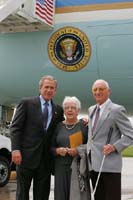 President George W. Bush met Sidney Harris upon arrival in Youngstown, Ohio, on Tuesday, May 25, 2004. Harris is an active volunteer at a local hospital who assists patients and comforts their family members and friends.