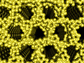 Illustration showing shimmering platinum atoms forming a gaping honeycomb structure.