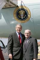 President George W. Bush presented the President’s Volunteer Service Award to Andrew “Woody” Woodcock upon arrival in Montgomery, Alabama, on Thursday, March 10, 2005.  Woodcock, 68, is an active volunteer with the Central Alabama Laubach Literacy Council.