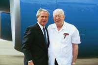 President George W. Bush met Scotty Maconochie upon arrival in Detroit, Michigan, on Wednesday, July 7, 2004. Maconochie, a World War II veteran, is a volunteer motivational speaker at the Oakland County Sheriff's Office Boot Camp.