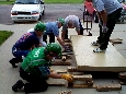 These photos show the participants practicing levering and cribbing. Participants gain confidence in their ability to lift objects in order to extract victims. An instructor coaches the participants in proper techniques and safety.  Click to enlarge.
