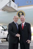 President George W. Bush presented the President’s Volunteer Service Award to Dave Kruger upon arrival at the airport in Chicago, Illinois, on Thursday, July 6, 2006.  Kruger is a volunteer with the United Service Organizations (USO) of Illinois.  To thank them for making a difference in the lives of others, President Bush honors a local volunteer, called a USA Freedom Corps greeter, when he travels throughout the United States.  President Bush has met with more than 500 individuals around the country, like Kruger, since March 2002.