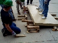 These photos show the participants practicing levering and cribbing. Participants gain confidence in their ability to lift objects in order to extract victims. An instructor coaches the participants in proper techniques and safety.  Click to enlarge.