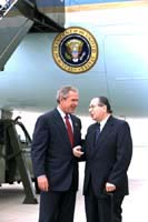 President George W. Bush met David A. Shapiro upon arrival in Little Rock, Arkansas, on Monday, May 5, 2003. Shapiro volunteers as a member of the SCORE (Service Corps of Retired Executives) program, a resource partner of the U.S. Small Business Administration.