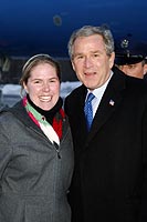 President George W. Bush met Kimberly Lucia upon arrival in Greenwich, Connecticut, on Thursday, January 29, 2004.  As an active member of AmeriCorps*VISTA, Lucia volunteers with the American Red Cross National Preparedness and Response Corps.