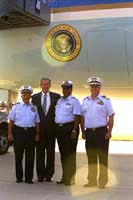 President George W. Bush met Thomas Angott, Darlene Husband, and Roland Nusly upon arrival in Detroit, Michigan on Monday, September 9, 2002. All three are members of the U.S. Coast Guard Auxiliary and assist the U.S. Coast Guard with non-law enforcement programs such as boating safety, search and rescue, public education and safety patrols. 