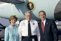 President George W. Bush met Chip Collins upon arrival in St. Petersburg, Florida, on Friday, October 22, 2004.  Collins, 69, is an active volunteer with the Volunteers in Police Service (VIPS) program in the Clearwater Police Department Park Patrol.