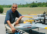 Photo of V. Ramanathan with several unmanned aerial vehicles.