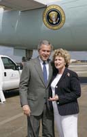 President George W. Bush presented the President’s Volunteer Service Award to Julie Whitney upon arrival in Tampa, Florida, on Tuesday, May 9, 2006.  Whitney is a volunteer with the Bayshore Patriots.  To thank them for making a difference in the lives of others, President Bush honors a local volunteer, called a USA Freedom Corps greeter, when he travels throughout the United States. Whitney is the 501st volunteer to greet President Bush since March 2002.