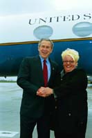 President George W. Bush met Robin Black upon arrival in Huntington, West Virginia, on Friday, April 2, 2004.  Black is an active volunteer with the Huntington West Virginia Housing Authority, spending time with the self-sufficiency programs that assist families and the elderly.  
