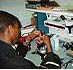 Picture of male student assembling a computer.