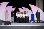 David Eisner, CEO of the Corporation for National and Community Service, congralates AmeriCorps members who were honored with Spirit of Service awards during the opening plenary session of the National Conference on Volunteering and Service. From left to right are AmeriCorps member Crystal Utley of Jackson, MS; Eisner; AmeriCorps*NCCC Western Region Tearm Red 4; AmeriCorps*VISTA Winny vanGils of St. George Utah; and AmeriCorps alum Alaric Phillips of Baltimore, MD.