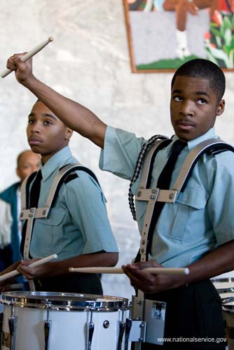 A student from the IDEA Public Charter School in Washington, D.C., provides accompaniment at the District Building during the opening ceremony for the 2008 Martin Luther King Day of Service. About 20,000 people in the District of Columbia participated in nearly 150 service projects in honor of the slain civil rights leader on January 21, 2008.