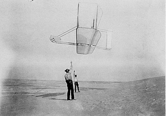 Photo of the Wright 1902 aircraft in flight