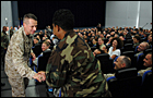 Chairman of the Joint Chiefs of Staff U.S. Marine Gen. Peter Pace shakes hands with an Air Force technical sergeant at the beginning of the townhall meeting in Stuttgart, Germany, July 20, 2007 Defense Dept. photo by U.S. Air Force Staff Sgt. D. Myles Cullen  