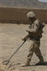Lance Cpl. Zachary R. Picking sweeps the streets for improvised explosive devices.