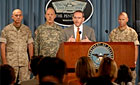 Photo - John Young, Mine Resistant Ambush Protected Vehicle Task Force, answers questions along with (left to right) Lt. Gen. John G. Castellaw, deputy commandant of the Marine Corps; Lt. Gen. Stephen M. Speakes, the Army’s deputy chief of staff for programs; and Brig. Gen. Michael M. Brogan, commander of Marine Corps Systems Command, during a Pentagon news conference on the procurement of MRAP vehicles, July 18, 2007.