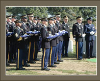 Army honor guard soldiers hold 12 folded American flags during an interment ceremony at Arlington National Cemetery on Oct. 12, 2007, for 12 soldiers killed in Iraq 10 months ago. The soldiers, 10 from the Army National Guard and two from the active-duty Army, were killed northeast of Baghdad when their UH-60 Black Hawk helicopter was shot down. U.S. Army photo by Sgt. Mary Flynn 