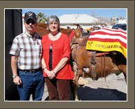 Wesley and Peggy Bushnell stand beside the riderless horse that honored their son, Sgt. William Bushnell, during El Paso, Texas’ homecoming parade for 4th Brigade Combat Team, 1st Infantry Division, Feb. 27, 2008. Wesley Bushnell walked with the horse during the parade as a tribute to his son, who was killed in Iraq. Photo by Donna Miles  
