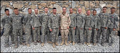 U.S. Navy Adm. Mike Mullen, chairman of the Joint Chiefs of Staff, poses for a group photo with award recipients from the 503rd Infantry Regiment, Korengal Outpost, Afghanistan, July 11, 2008.