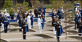 One hundred eighty-four joint service troops unveil the Pentagon Memorial, Sept. 11, 2008. The national memorial is the first to be dedicated to those killed at the Pentagon on Sept. 11, 2001. The site contains 184 inscribed memorial units honoring the 59 people aboard American Airlines Flight 77 and the 125 in the building who lost their lives that day. Defense Dept. photo by U.S. Air Force Master Sgt. Adam Stump