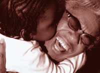 Image of woman hugging grandchild