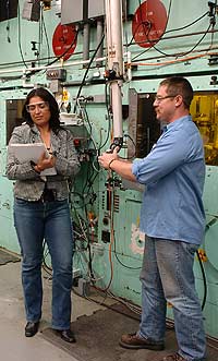 A chemical engineer and technician confer in preparation for a remote test in Argonne's shielded-cell facility