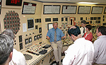 NRC instructor, Richard DeVercelly, explains about a reactor's control room using a simulatorat the TTC