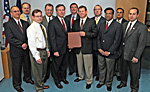 NRC's review team lead by William Borchardt, Director, Office of New Reactors (left center) stands ready to accept an application to build the first nuclear reactor in almost 30 years from NRG Energy Inc. provided by Mark McBurnett, VP for South Texas Project Nuclear Operating Co. (right center)