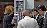 NRC staff (left and center) discuss with Toshiba staff a model of the company's "4S" small reactor design at NRC headquarters during a public meeting on pre-application activities