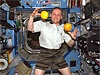Expedition 9 astronaut Mike Fincke juggles oranges in zero gravity
