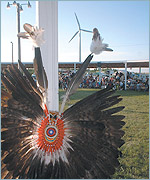 July 4th powwow at the Rosebud Sioux Reservation with the tribe's 750 kW NEG Micon turbine in the background.
