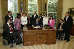 President George W. Bush signs the executive order renaming the President's Committee on Mental Retardation to the President's Committee for People with Intellectual Disabilities 