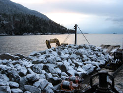barge bringing in granite to build reef