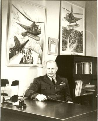 A photo of helicopter pioneer and Coast Guard officer Frank Erickson at his desk