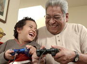 older man and young boy playing video game