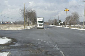 Offsetting the rightturn lane, as shown in this photo from Michigan, provides crossroad traffic with a better view of oncoming mainline traffic, even when large trucks are in the right-turn lane.