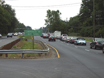 One of the easiest ways to simplify intersection driving is to post the name of the crossroad well in advance, as shown in this photos.