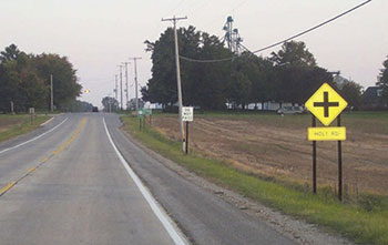 One of the easiest ways to simplify intersection driving is to post the name of the crossroad well in advance, as shown in this photos.