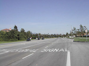 Motorists are alerted to an upcoming signal in Irvine, CA.