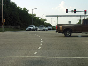 The extension of left-turn lane markings into an intersection, shown here in Overland Park, KS, is a common treatment to help guide multiple lanes of turning traffic through intersections.