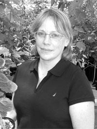 photo of Nancy Engle standing in greenhouse