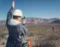 Surveyors prepare Midway Valley for pad excavation in February 1991.