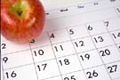 apple sitting on a calendar