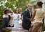 President George W. Bush greets Tamara Brooks after signing the S. 151, PROTECT Act of 2003, in the Rose Garden Wednesday, April 30, 2003. Brooks, 17, was rescued after an AMBER Alert was issued throughout Orange County, Calif., alerting the community of her abduction. Donna Norris, left, embraces her son Ricky after the bill signing. The AMBER Alert system is named in honor of her 9-year-old daughter, Amber Hagerman, who was abducted while playing near her Arlington, Texas, home and later found murdered.  White House photo by Paul Morse